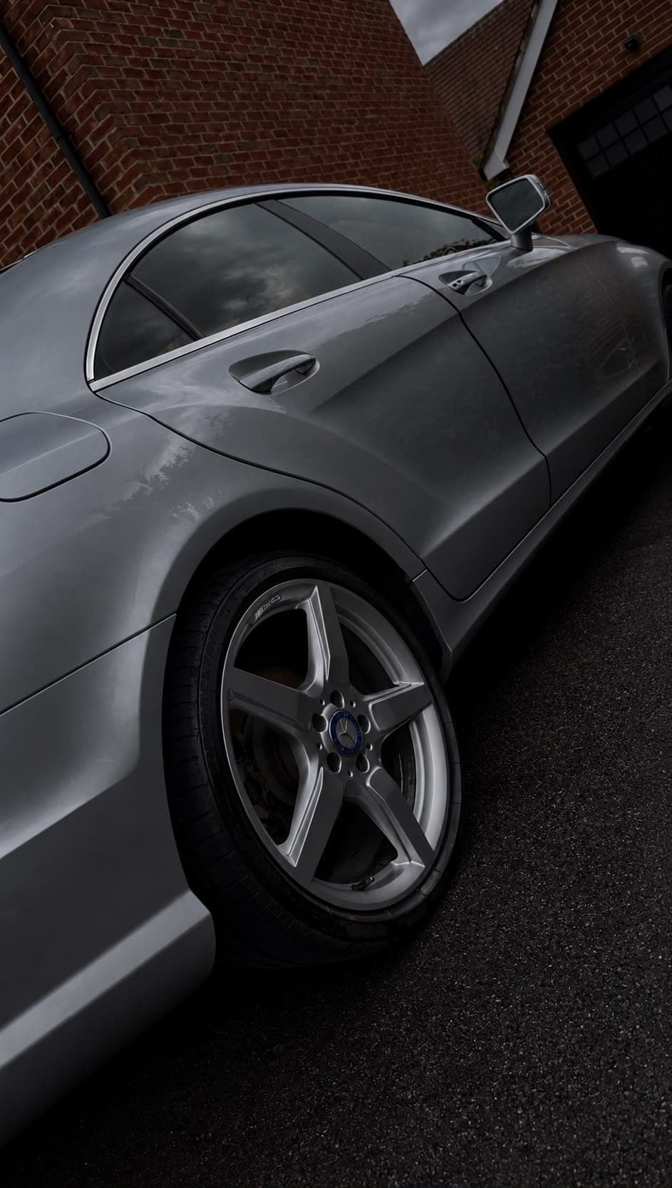 Side profile and alloy wheel of a silver Mercedes CLS after a full valet
