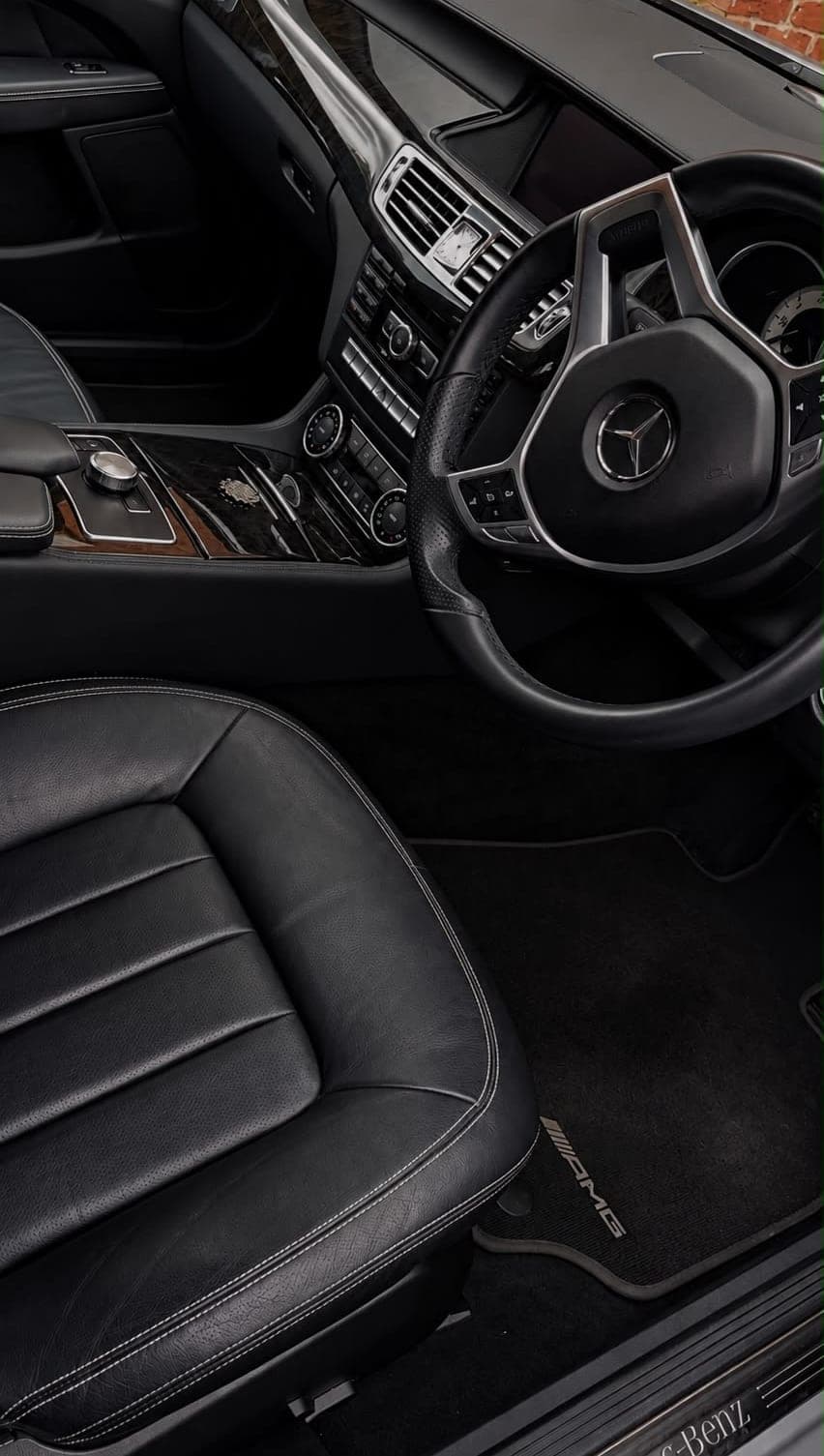 Spotless black leather interior of a Mercedes CLS after an interior valet